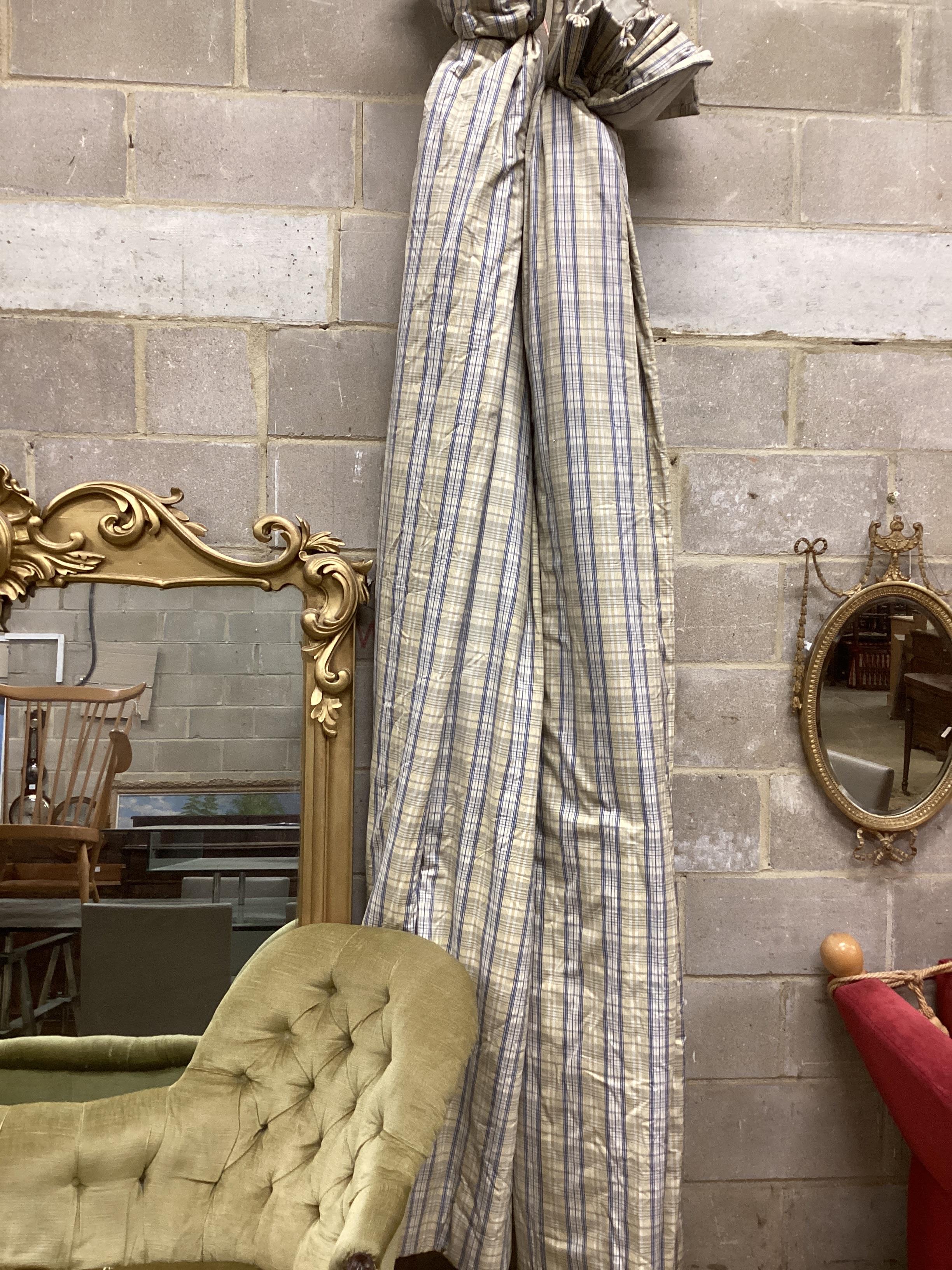 A pair of blue / gold check lined curtains approximate widths 140cm top, 320cm floor, drop 250cm with five matching drapes three cushions and a blue floral bedspread